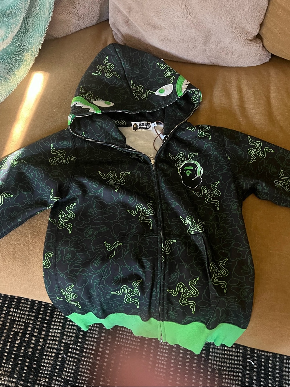 A Bathing Ape Black Hoodie with Green Graphic Print